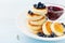 Cottage cheese pancakes or curd fritters with honey and blueberry. Delicious and diet breakfast.