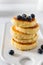 Cottage cheese pancakes with fresh blueberries and honey. Russian syrniki or sirniki, cottage cheese fritters or pancakes served