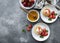 Cottage cheese pancakes, ricotta fritters on ceramic plate with  fresh strawberry