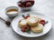 Cottage cheese pancakes, ricotta fritters on ceramic plate with  fresh strawberry