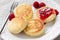 Cottage cheese pancakes or syrniki with raspberry jam