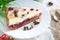 Cottage cheese pie with cherries on table. Delicious curd berry dessert