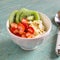 Cottage cheese with strawberries, kiwi, honey and flax seeds - healthy Breakfast in a white bowl