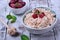 Cottage cheese topped with raspberries in a bowl