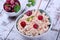 Cottage cheese topped with raspberries in a bowl