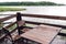 Cottage in forest near river with big wooden terrace. House on the water at the lake, a beautiful bank. Ideal place for