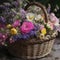 Cottage garden flowers in a woven basket. Mother\\\'s Day Flowers Design concept