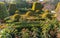 Cottage garden with topiary and trimmed bushes