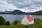 Cottage with red roof located on Loch Shieldaig, surrounded by the Torridon mountains on the Applecross Peninsula, Scotland