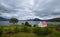 Cottage with red roof located on Loch Shieldaig, surrounded by the Torridon mountains on the Applecross Peninsula, Scotland