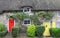 Cottage with straw thatched roof and colorful doors