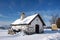 Cottage in winter landscape