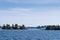 Cottages and a boathouse on wavy water in the Thousand Islands area in New York, USA