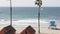 Cottages in Oceanside California USA. Beachfront bungalows. Ocean beach palm trees. Lifeguard tower.