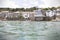 Cottages overlooking Mousehole Harbour in summer