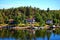 Cottages on river bank in woods, european places