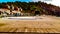 Cottages on a sunny day and a hill