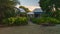 Cottages surrounded by greenery under the sunlight and a blue sky in Utila