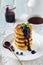 Cottege cheese pancakes Gluten-free with blueberry sauce on a light background.