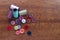 Cotton, buttons and sewing needles on a wooden darning table