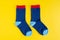 Cotton kids socks composition on yellow background