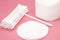 Cotton pads and swabs, bulk of tips. Cotton cosmetic swabs for ear cleaning. Personal care, personal hygiene. Hygienic sanitary sw