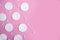 Cotton sponges and cotton buds pattern on pink background, minimal concept
