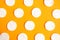 Cotton sponges pattern on bright orange background