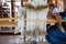 Cotton weaving. Woman weaving cotton on manual loom. Thai cotton handmade. Homespun fabric process. The process of fabric weaving