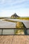 The Couesnon river flowing to the Mont Saint-Michel tidal island in Normandy, France