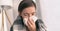 Cough in tissue covering nose and mouth when coughing as COVID-19 hygiene guidelines for coronavirus spread prevention