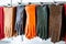 A counter with colorful leather gloves. Large selection of classic gloves in the store