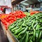 Counter with cucumbers and tomatoes in the market.