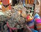 Counter in Morocco street vendor of old things - junk with old used jewelry, jewelry, metal and ceramic crockery and clothing