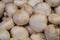 Counter with mushrooms in the store, white champignons in the supermarket