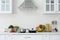Counter with set of dishware, utensils and products in stylish kitchen