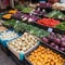 Counter of a street vegetable shop, fresh ripe fruits and vegetables in boxes, close-up, bright colors,