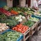 Counter of a street vegetable shop, fresh ripe fruits and vegetables in boxes, close-up, bright colors,