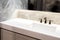 Counter top white marble,quartz with washbasin.Wall and floor beige,grey marble stone tile interior design of restroom or toilet b