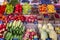 A counter with a variety of vibrant fruits and vegetables. Blurred