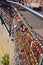 Countless, colorful love padlocks hanging on a railing at the river Ilmenau in Lueneburg