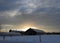 Country barns with cupola silhouette winter sunset