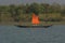 A country boat of fisher men sailing on Matla river at Sundarban