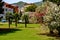 Country cottage courtyard with palm trees and a boat