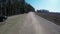 Country driving car on gravel road using a fisheye lens. Slow motion