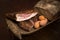 Country food, loaf of bread, smoked bacon, eggs still life rural setting