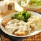 Country fried steak with side dishes