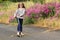 Country girl playing by wild flowers.