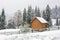 Country house during heavy snowfall in Carpathians mountains