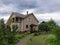 Country house with tiled roof and chimney. Architecture of countryside